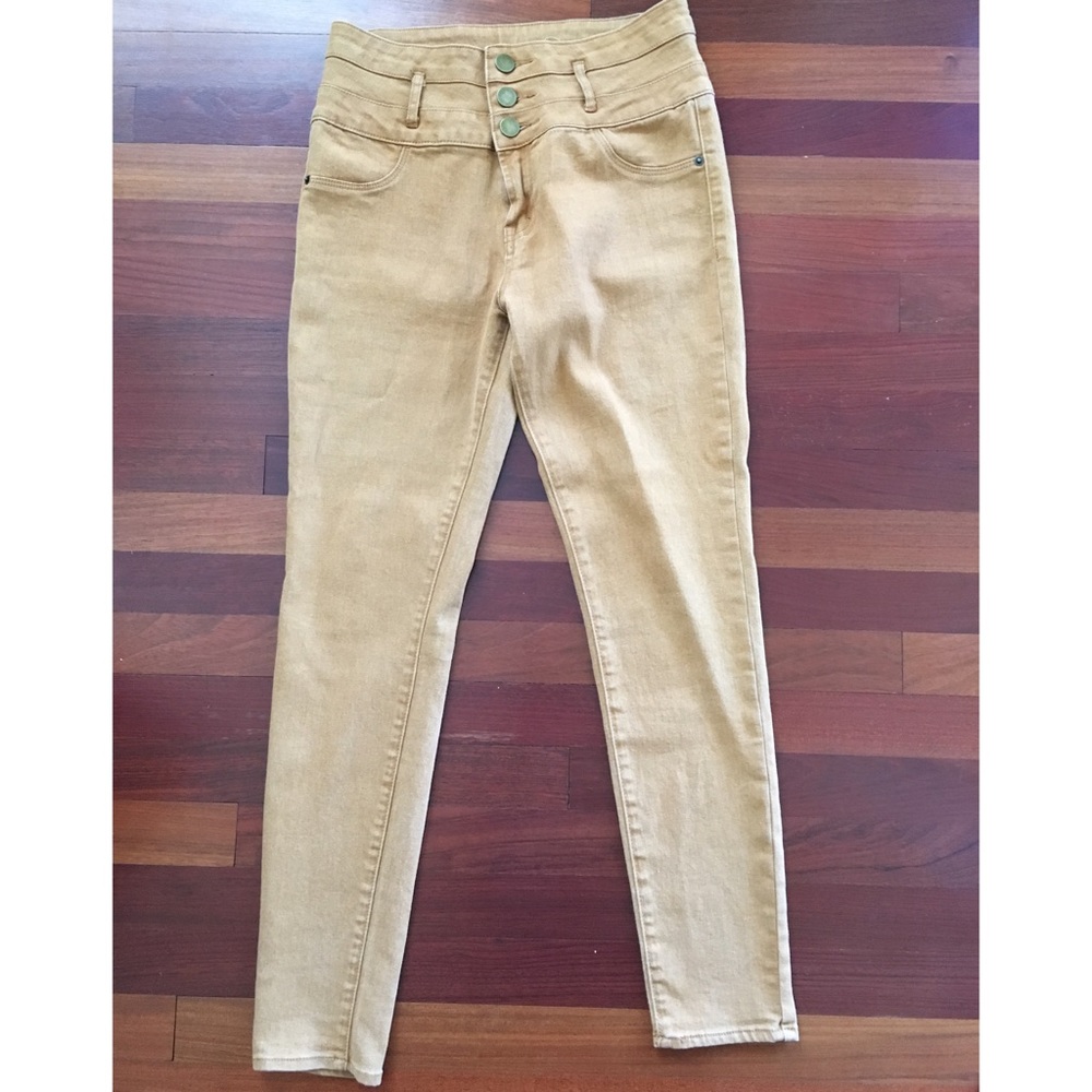 Gold colored high-waist skinny jeans
